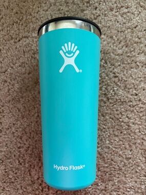 22 oz Hydro Flask Turquoise Travel Tumbler with Outdoor Women’s Alliance sticker